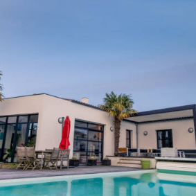 A large pool with a house in the background